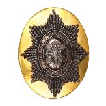 An officer’s gilt shoulder belt plate of The 4th Royal Irish Dragoon Guards, of slightly convex oval