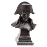 A bronzed bust of Napoleon,  with high collar and bicorne hat on integral plinth, signed on the back