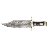 A massive modern bowie knife,  etched imitation damascus blade 12” x 3” with broad shallow