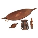 A New Guinea Sepik River boat shaped wooden dish,  18½”, with carved decoration, pointed handles and