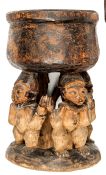 A carved wood standing bowl from Cameroon, 7½” diameter, height 11½”, the bowl supported by four