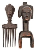 An  Ivory Coast Baoule carved hardwood comb,  with 6 long teeth, the handle in the form of female