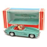 Tekno Mercedes Benz 300SL open top (924). Example in light metallic green with red interior and
