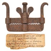 An interesting old iron museum copy of a thumbscrew torture instrument, with serrated jaws, width
