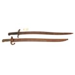 A Chassepot bayonet,  markings removed from back of blade, in scabbard (rusted); and an Enfield