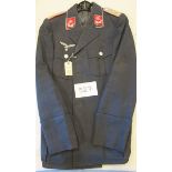 A German Luftwaffe officer’s tunic,  with silver bullion piping to the collar and with Third Reich