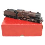 TRIX OO gauge LMS 4-4-0 Compound locomotive and tender. RN 1168 in lined maroon livery. In