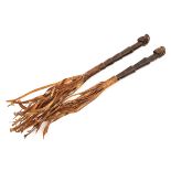 2  Ivory Coast Baoule fly whisks,  the wooden handles carved in tapered steps terminating in heads