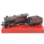 TRIX OO gauge LMS 4-4-0 Compound locomotive and tender. RN 1168 in lined maroon livery. In