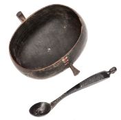 A 19th century East African, probably Masai, carved oval deep hardwood bowl, with small ear like