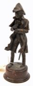 A well modelled bronzed composition figure of Wellington, in full dress, holding telescope, and
