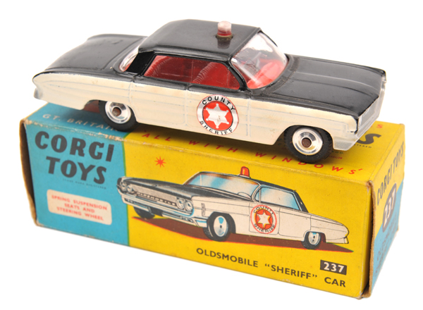 Corgi Toys Oldsmobile “Sheriff” Car (237). In gloss black and white with red interior, light to