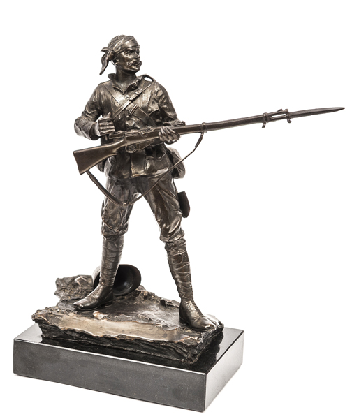 A bronze figure “A Gentleman in Khaki” on black marble plinth, height 10”, a standing soldier,