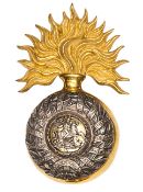 An officer’s gilt and silver plated bearskin grenade badge of The 5th (Northumberland Fusiliers),