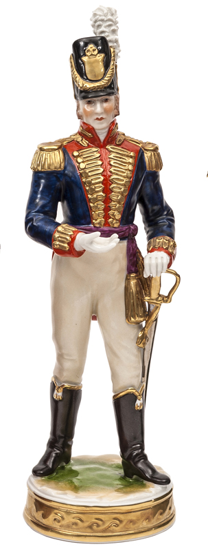 A continental painted porcelain figure of a Napoleonic war period officer of The R. Artillery, in