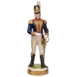 A continental painted porcelain figure of a Napoleonic war period officer of The R. Artillery, in