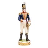 A continental painted porcelain figure of a Napoleonic war period officer of The R. Artillery, in