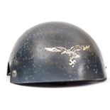 A rare Battle of Britain period Luftwaffe pilot’s steel helmet,  to be worn over the flying