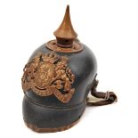 A Bavarian pickelhaube, the leather skull with brass badge and mounts, leather lining and original