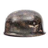 A Third Reich Luftwaffe parachutist’s helmet, the skull with ET maker’s mark (Eisenhuttenwerke,