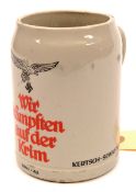 A German ½ litre stoneware beer stein,  with transfer printed Luftwaffe eagle over “Wir Kampften auf