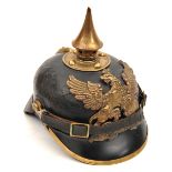 A Baden pickelhaube,  with brass badge and mounts and original leather chinstrap. Basically GC (no