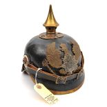 A German pickelhaube,  the leather skull with brass fittings, the inside and neck guard with