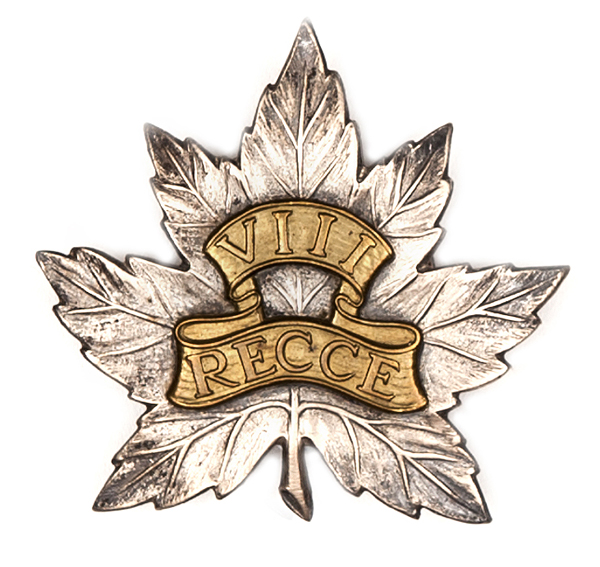 An OR’s bi-metal cap badge of the Canadian 8th Reconnaissance Unit. GC Plate 1