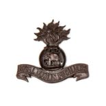 A good officer’s bronze cap badge of The R Dublin Fusiliers, marked J & Co. Near VGC Plate 1