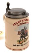 A German ½ litre stoneware beerstein, with coloured transfer printed design of a mounted drummer and