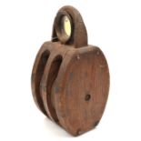 An oak pulley block, iron wheels diam 6”, iron suspension ring.