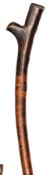 A Fijian brown wood fighting club, beaked head of traditional form, stout haft with shallow