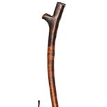 A Fijian brown wood fighting club, beaked head of traditional form, stout haft with shallow