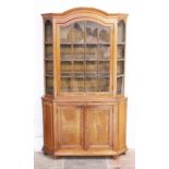 An oak display cabinet with arched top. Late 19th century. W123cm D30cm H220cm