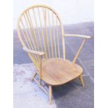 An Ercol light elm and beech arm chair. W74cm H95cm