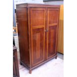 A fitted oak wardrobe. W118cm D56cm H183cm