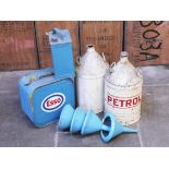 Two cone top petrol cans, two other cans and four funnels