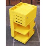 A yellow Plastic Artists utility trolley by Joe Columbo circa 1970. H77cm