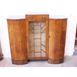 An Art Deco walnut cabinet bookcase. W124cm D35cm H116cm