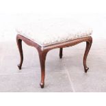 An Edwardian mahogany foot stool by Jas Shoolbred & Co. Label underneath and numbered B4297. H41cm