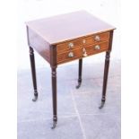 A 19th century cross banded mahogany writing table with two drawers and reeded legs. W55cm D44cm