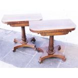 A pair of 19th century mahogany fold out card tables