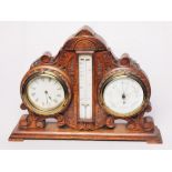 A clock and a barometer in carved oak frame. L38cm