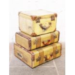 Three vintage suitcases each with a White Star Line sticker