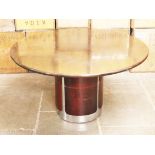 A retro chrome and mahogany dining table circa 1970. Diam. 129cm H72cm