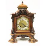 A late 19th Century walnut mantel clock the movement stamped RSM. H45cm