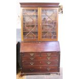 A George III mahogany bureau bookcase. W124cm D53cm H230cm