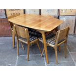 A retro walnut extending table and four chairs circa 1950s