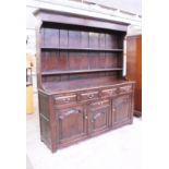 An oak dresser. W181cm D49cm H203cm