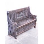 A carved oak bench. Early 20th century. L126cm